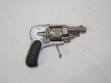 a small gun that is on a white surface