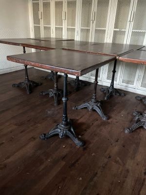 two tables that are sitting in the middle of a room