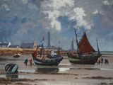 two boats that are sitting on the beach