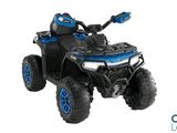 the toy atv is blue and black with blue wheels