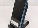 a cell phone that is sitting on top of a stand