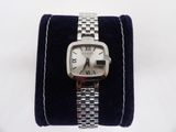 a watch that is sitting on top of a blue velvet case