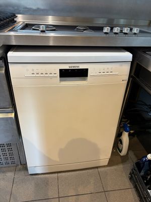a dishwasher and a stove in a kitchen