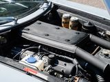 a close up of a car ' s engine with its hood open