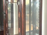 a display case with a glass door in a room