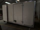 an image of a large white trailer in a garage