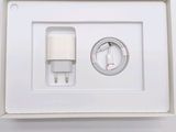 a white box with a charger and a plug in it