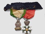 two medals and a medal on a white background