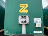 a green box truck with a yellow z logo on it