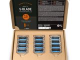 six blue razor blades in a cardboard box on a white background