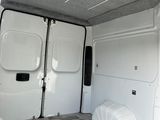 a white van that is parked in a lot