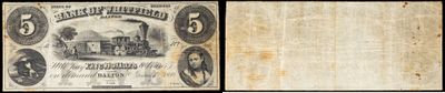 un vieux papier sur lequel figurent le portrait d'un homme et celui d'une femme