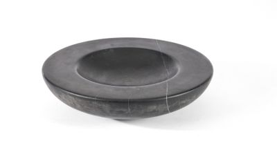 a black bowl on a white surface with a white background