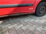 a red truck parked on the side of the road
