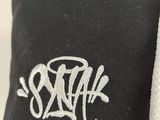 black and white photograph of a pair of socks with a white logo on them