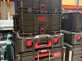 many boxes that are stacked on a shelf in a store