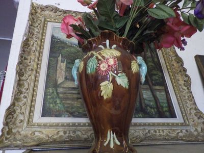 a picture of a vase with flowers in it on a table