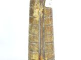 a small vase that has a brown and yellow design on it