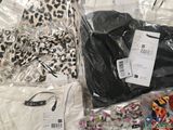 a pile of clothes and other items on a table