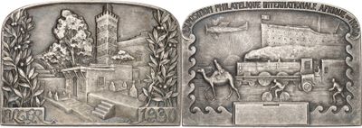 an image of a silver medal with a train on it
