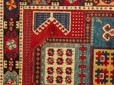 a close up of a rug with many different colors and patterns