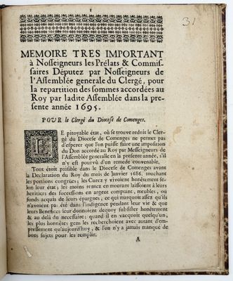 an old book with writing on it sitting on a table