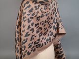 a leopard print shawl on a mannequin mannequin mannequin mannequin mannequin mannequin mannequin mannequin mann