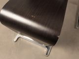 a wooden chair and a metal chair in a room