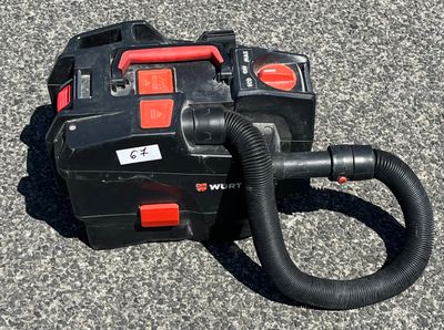 a black and red blower sitting on the ground