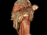 an image of a statue of a woman holding a child