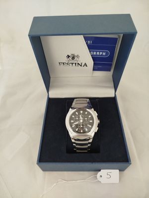 a watch that is in a box on a table
