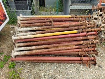 a pile of old rusty pipes sitting on the ground