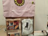 a cardboard box that has a bunch of items on top of it