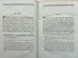 an open book with a picture of a cat on it