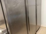 stainless steel refrigerators are lined up in a row in a kitchen