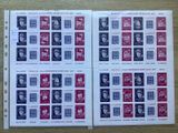 two pages of stamps with different faces on them on a table