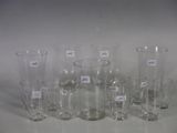a lot of glass vases that are sitting on a table