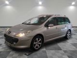the small silver car is parked in a large room