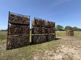 several crates of wood stacked on top of each other in a field
