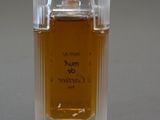 an image of a bottle of perfume on a table