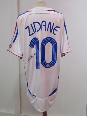 the jersey is white and blue with a number 10 on it