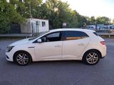 a picture of a white car parked in a parking lot