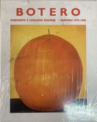 an orange is wrapped in plastic and sitting on a table