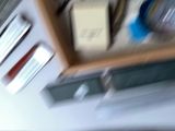 a blurry picture of a shelf with a bunch of items
