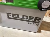 a green and white machine that is sitting on the floor