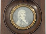 portrait d'un homme en costume-cravate, dans un cadre en bois