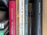 a box full of books that are sitting on top of each other