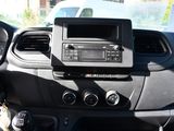 a dashboard of a car with a radio and a steering wheel