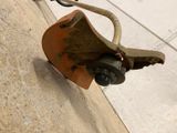 a close up of a skateboard with a handle attached to it