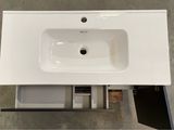 a white sink sitting on top of a white counter